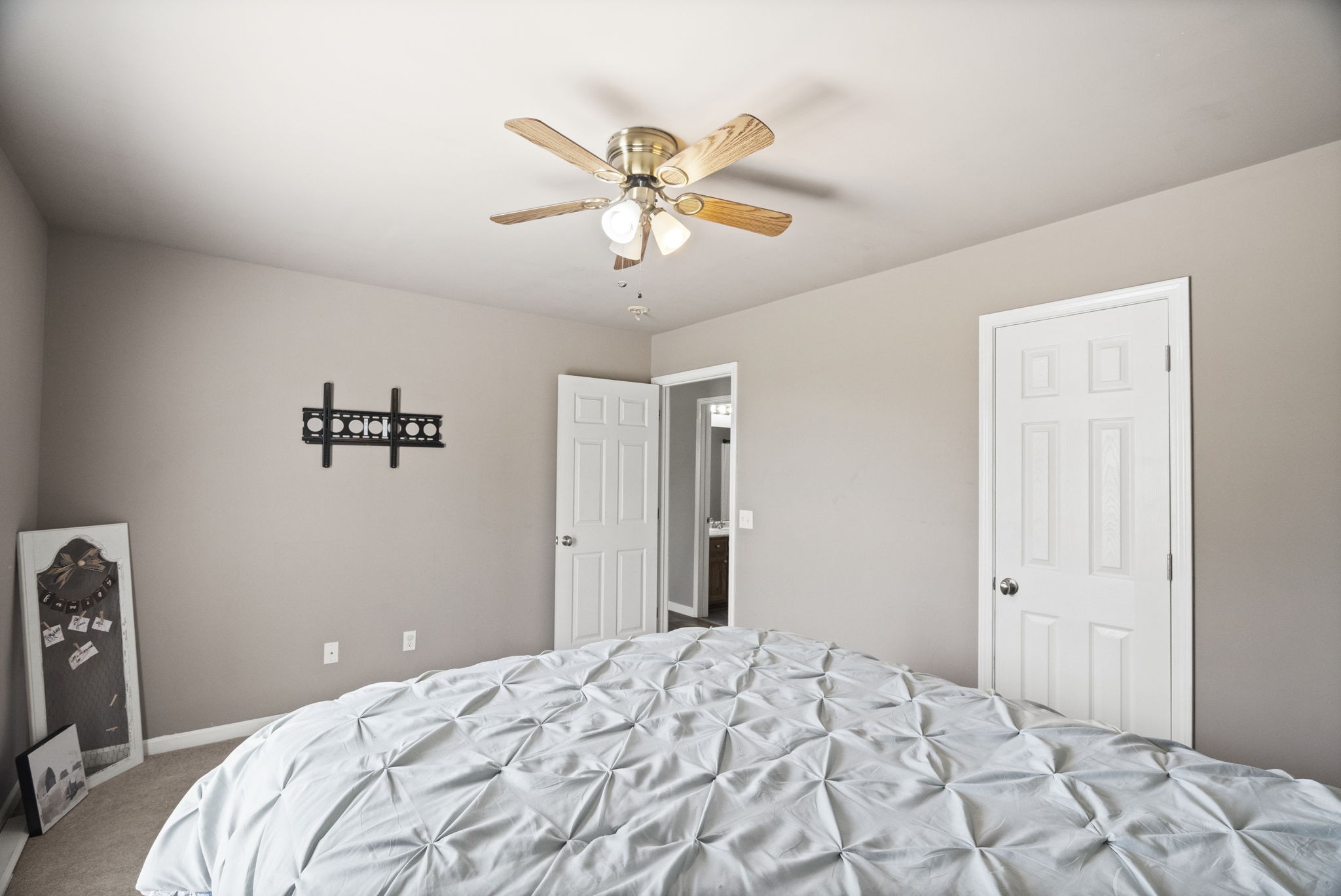 5958 Fred Perry Road Springfield, TN 37172 - Photo 15 of 32 a bedroom with a bed and a chandelier
