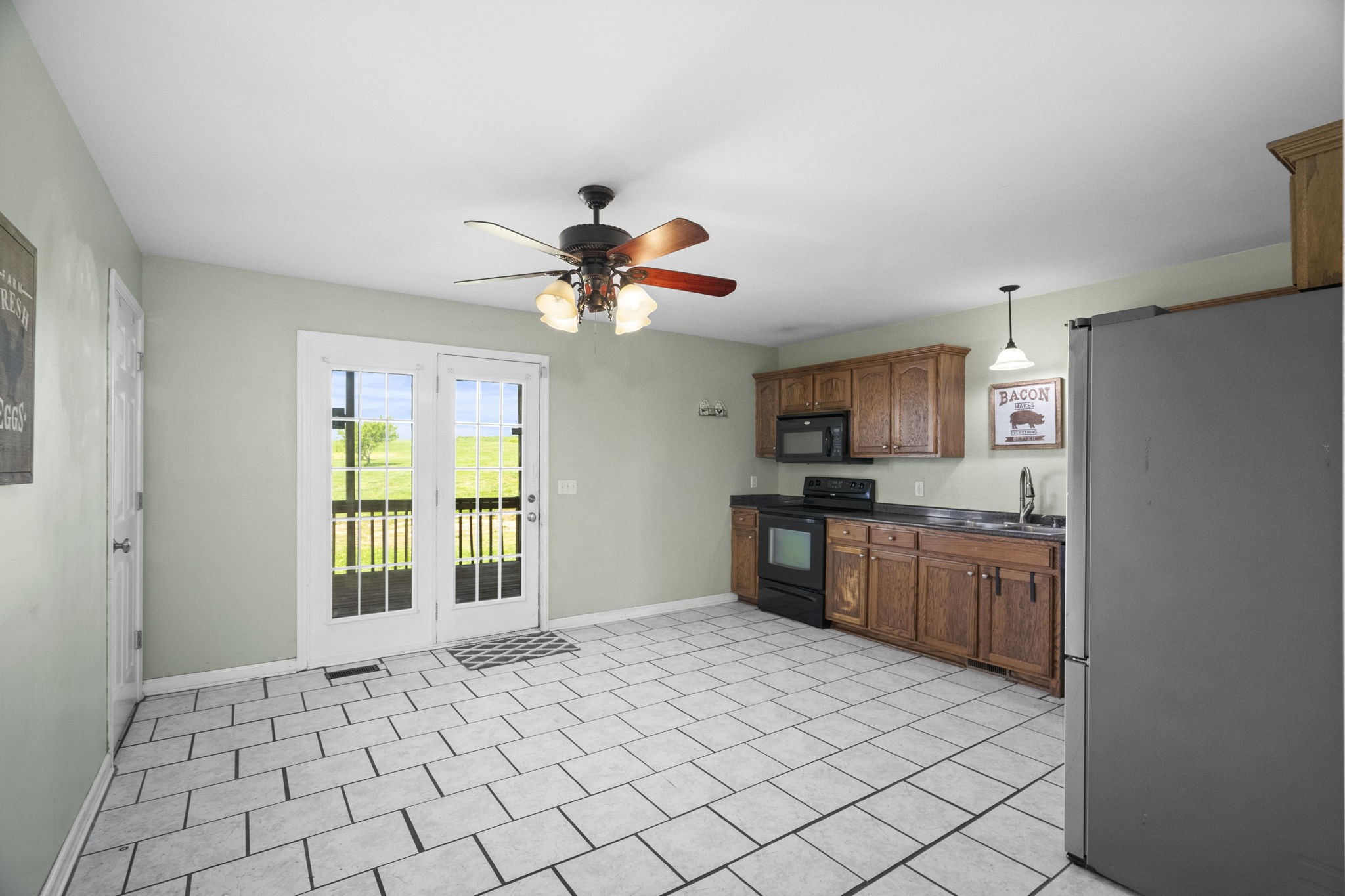 5958 Fred Perry Road Springfield, TN 37172 - Photo 18 of 32 a open kitchen with stainless steel appliances granite countertop a refrigerator and a sink