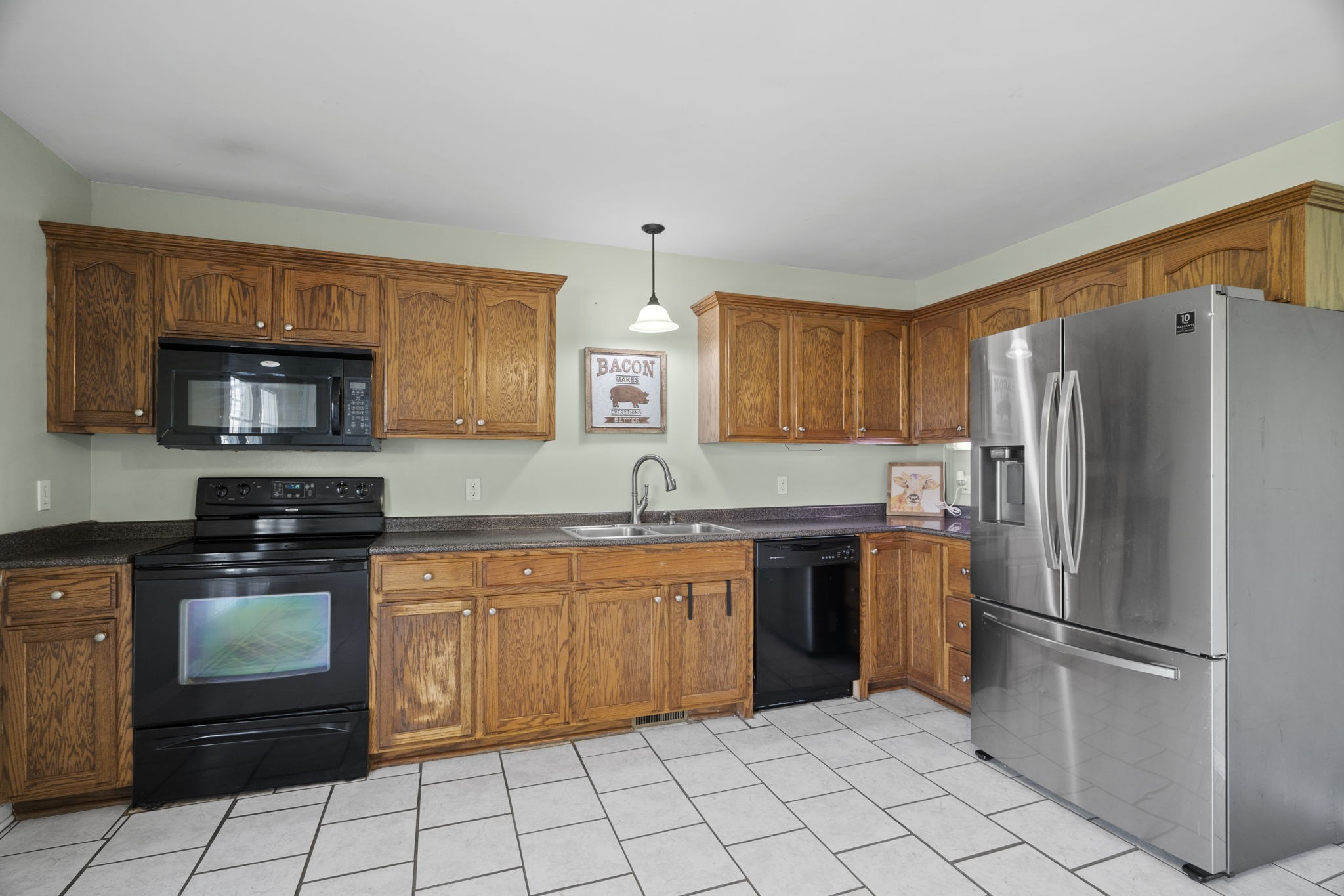 5958 Fred Perry Road Springfield, TN 37172 - Photo 20 of 32 a kitchen with stainless steel appliances granite countertop a refrigerator sink and stove