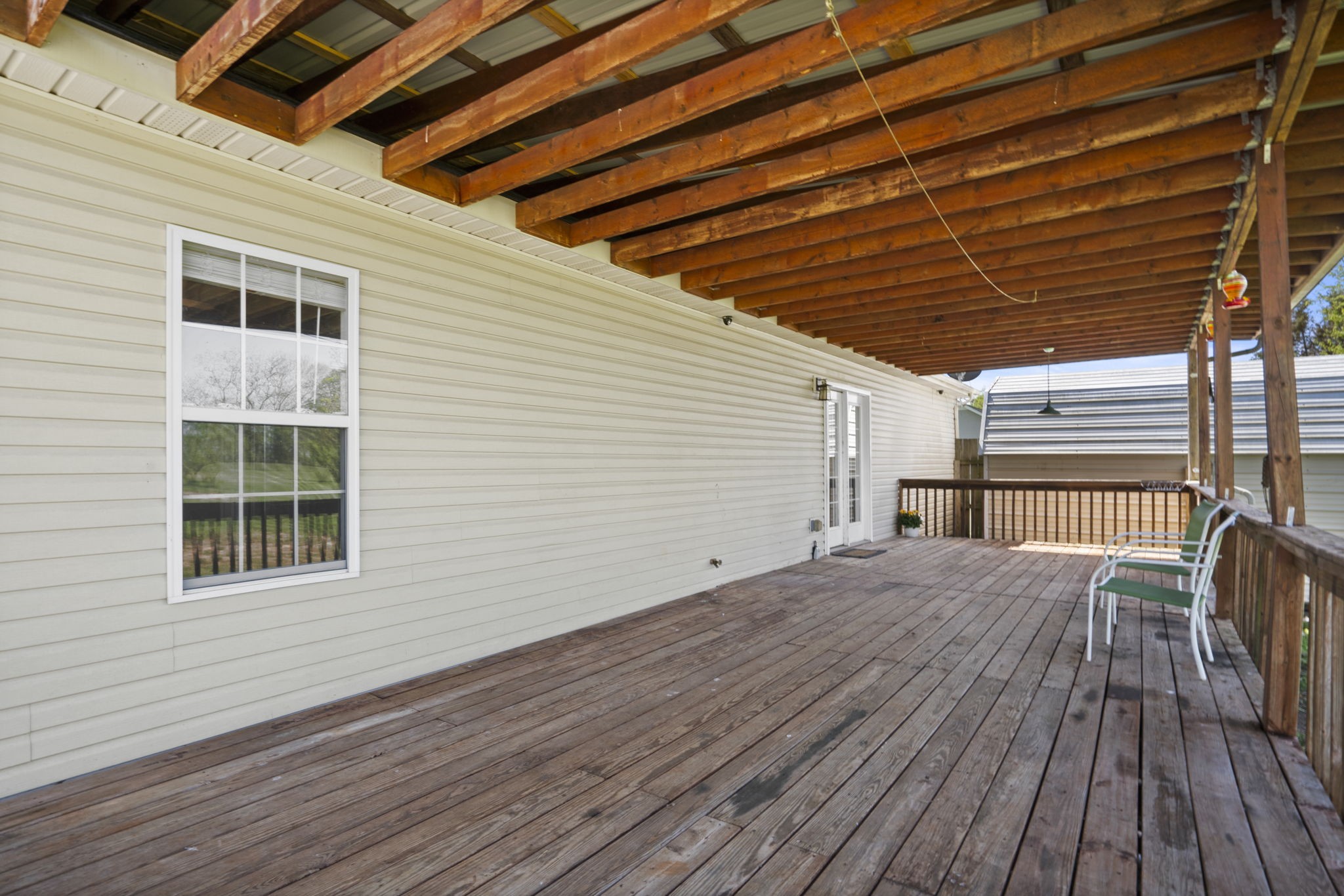 5958 Fred Perry Road Springfield, TN 37172 - Photo 23 of 32 a view of backyard with wooden deck and wooden floor