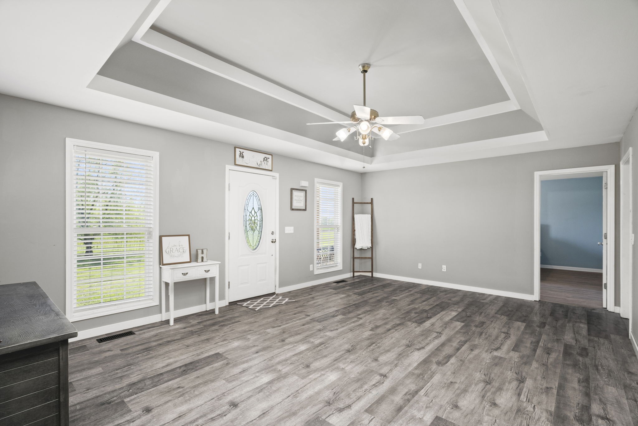 5958 Fred Perry Road Springfield, TN 37172 - Photo 7 of 32 an empty room with wooden floor chandelier and windows