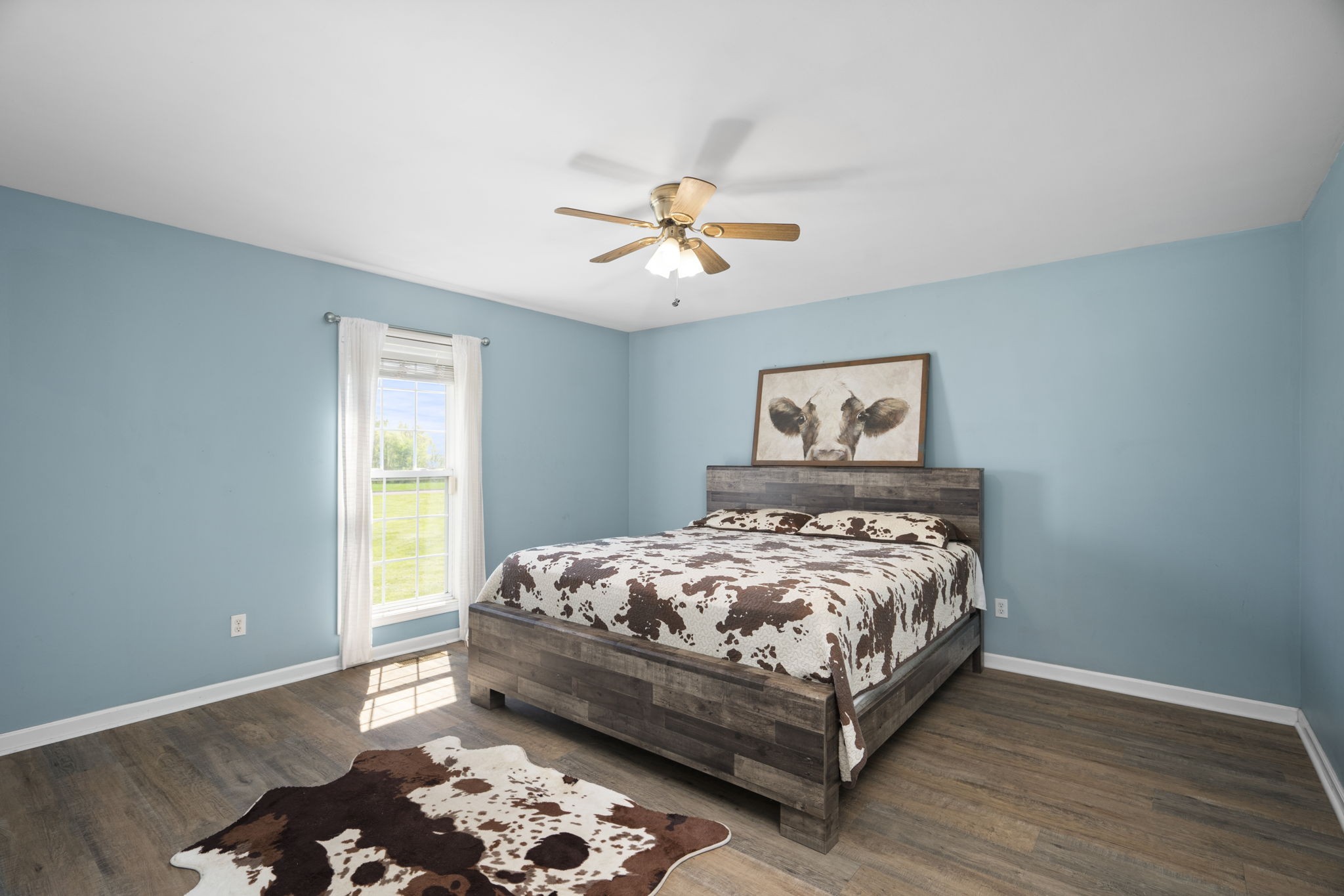 5958 Fred Perry Road Springfield, TN 37172 - Photo 9 of 32 a bed sitting in a bedroom next to a window