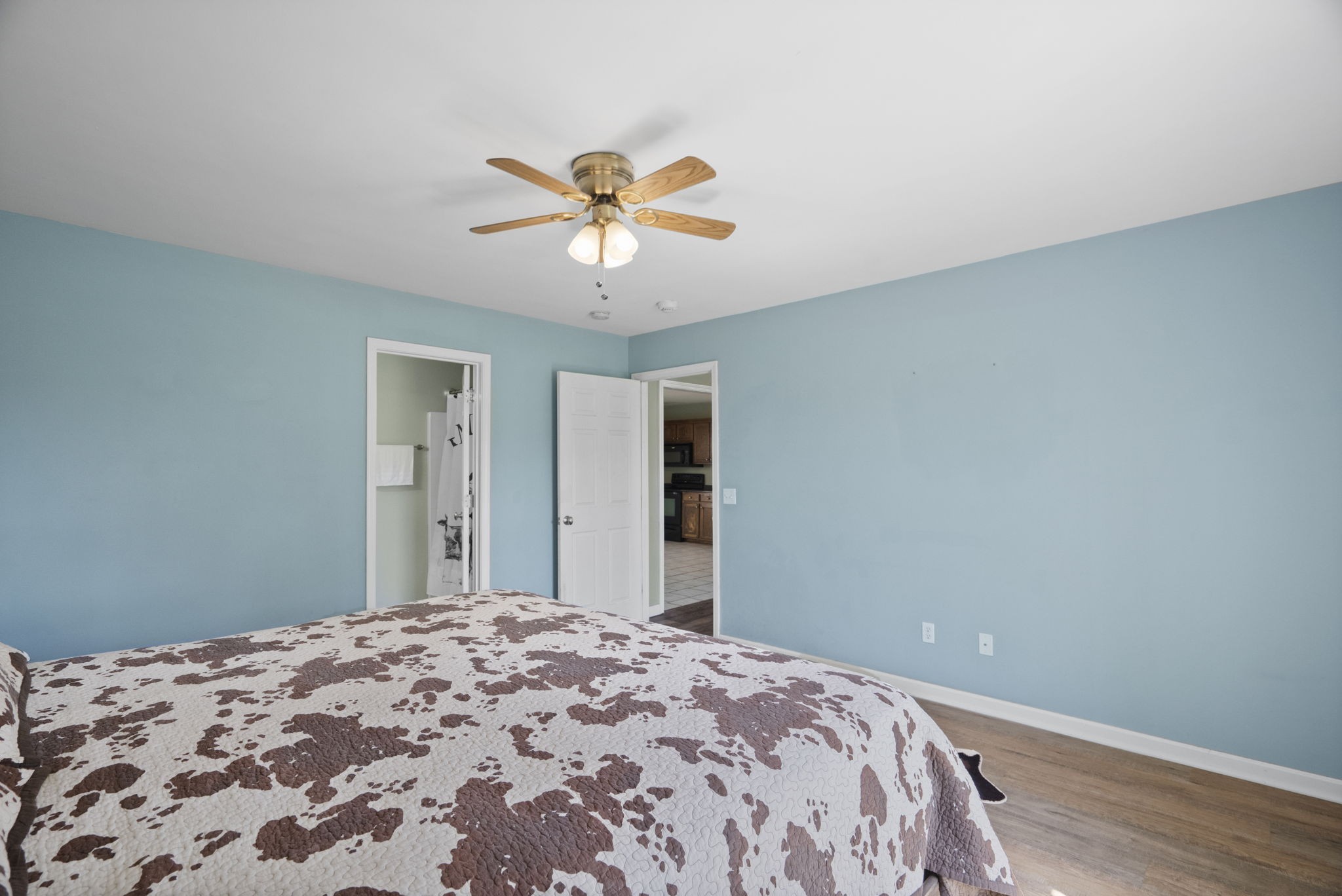 5958 Fred Perry Road Springfield, TN 37172 - Photo 10 of 32 a bedroom with a bed and a chandelier
