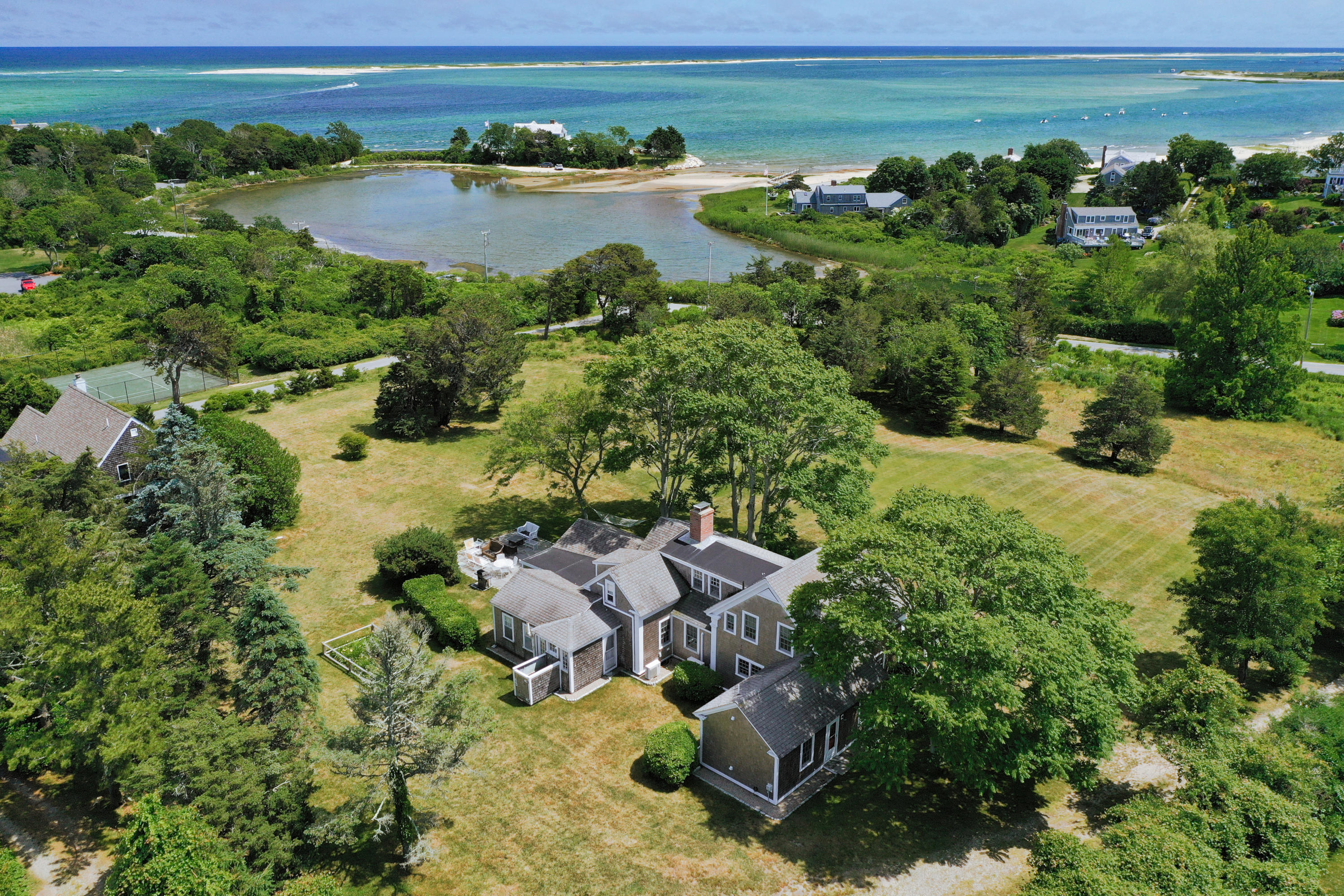 an aerial view of a house with a lake view