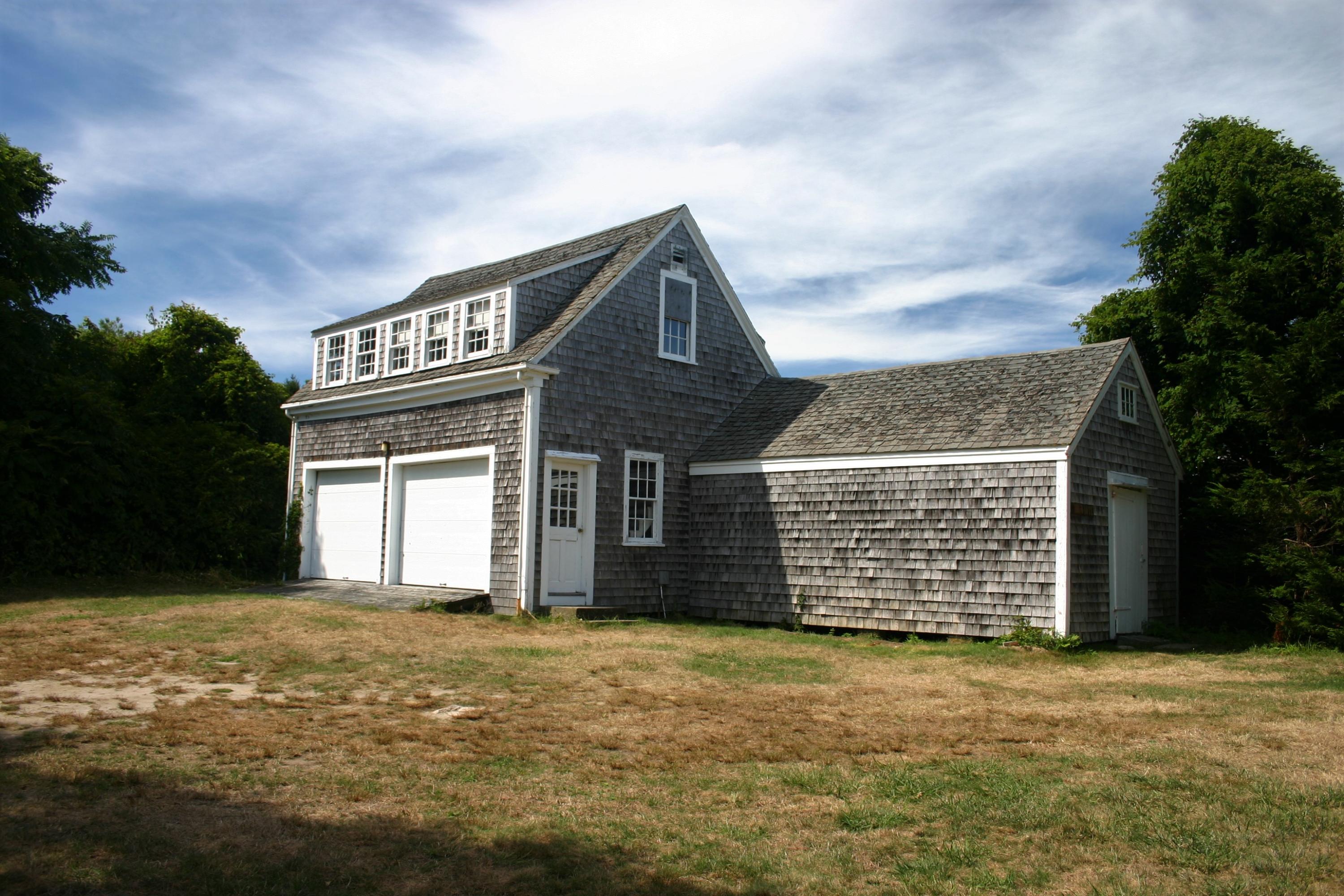 119 Scatteree Road North Chatham, MA 02650 - Photo 11 of 32 a front view of a house with a garden
