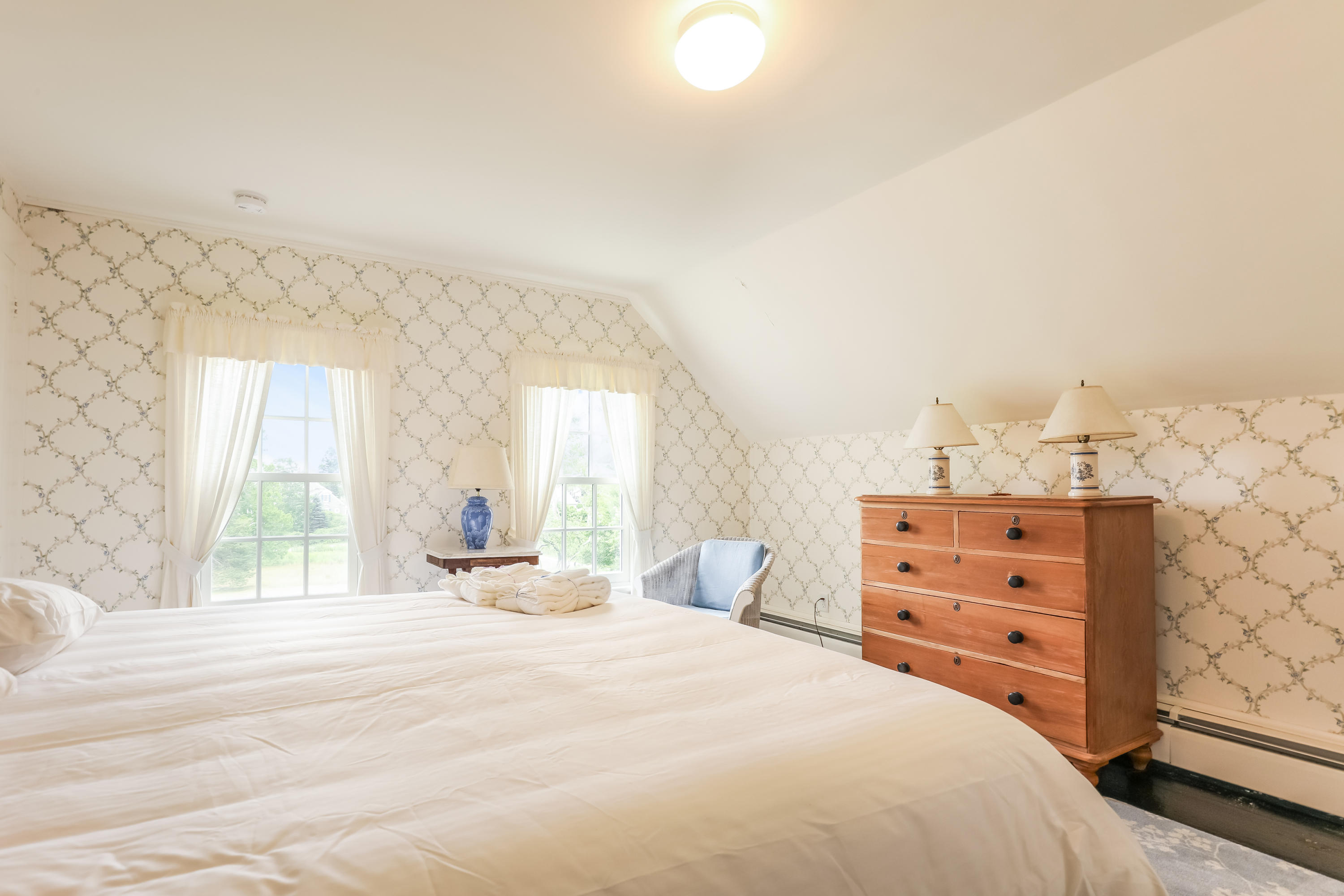119 Scatteree Road North Chatham, MA 02650 - Photo 24 of 32 a bedroom with a bed and a dresser