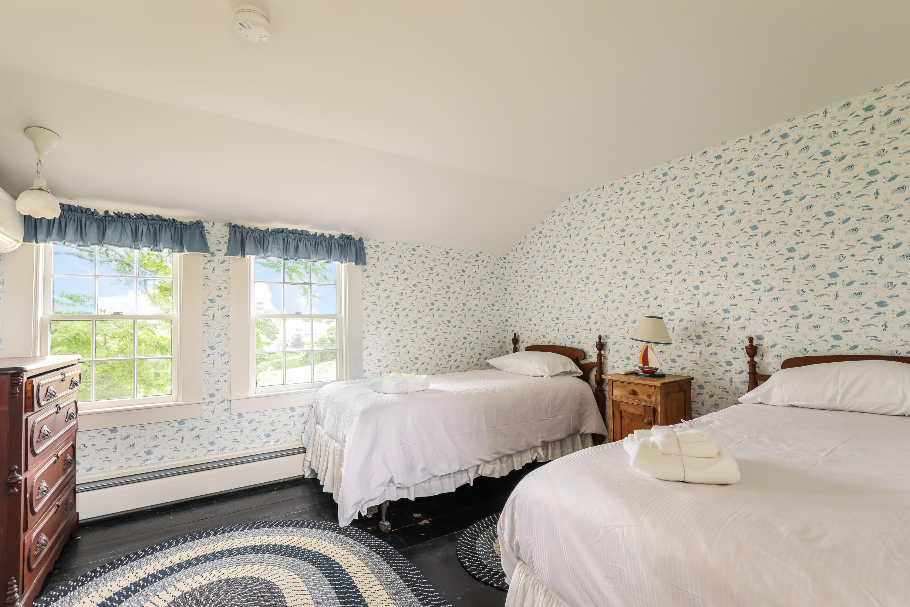 119 Scatteree Road North Chatham, MA 02650 - Photo 30 of 32 a bedroom with three beds and a large window