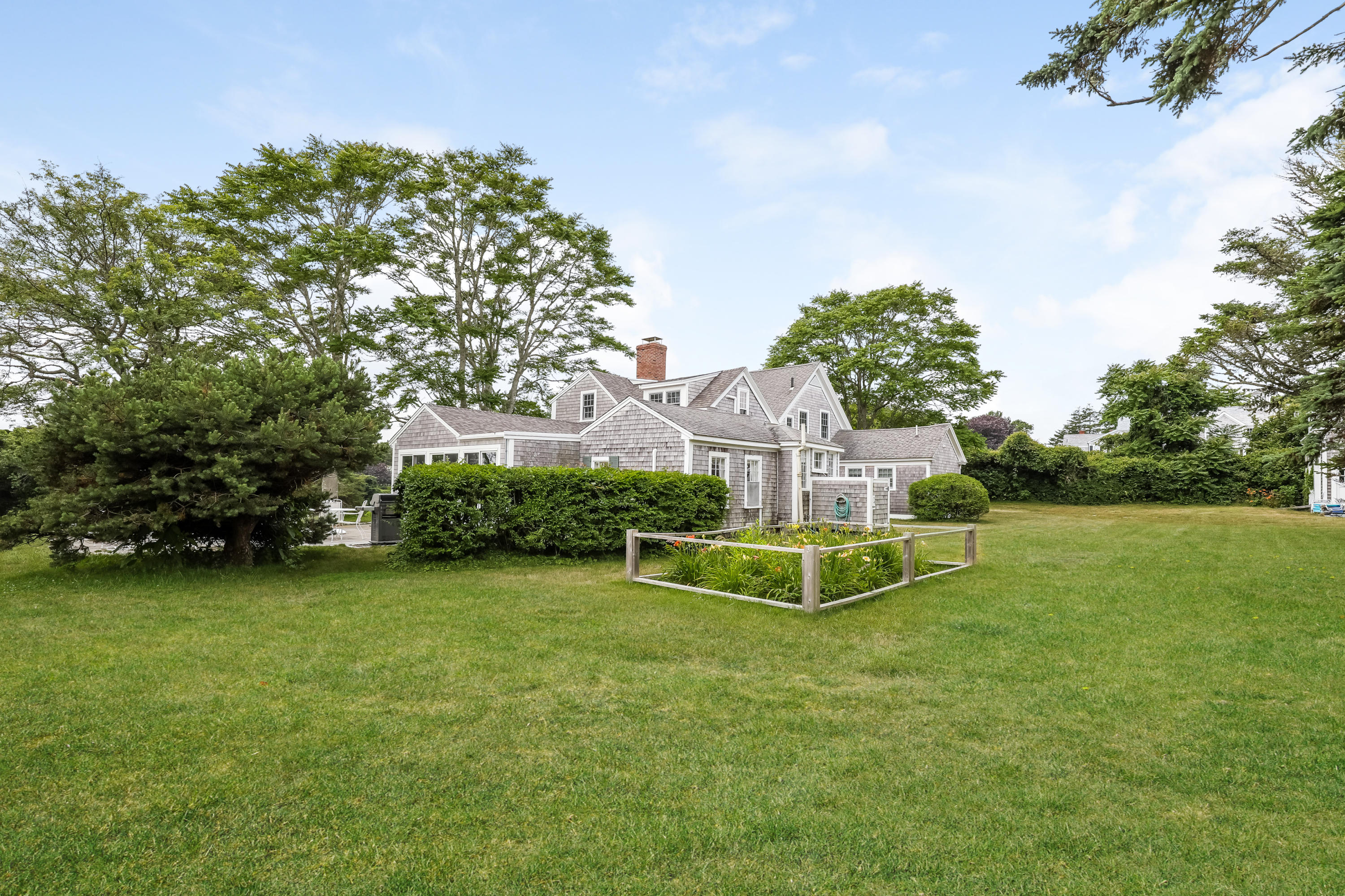 119 Scatteree Road North Chatham, MA 02650 - Photo 9 of 32 a view of a house with a yard and large trees