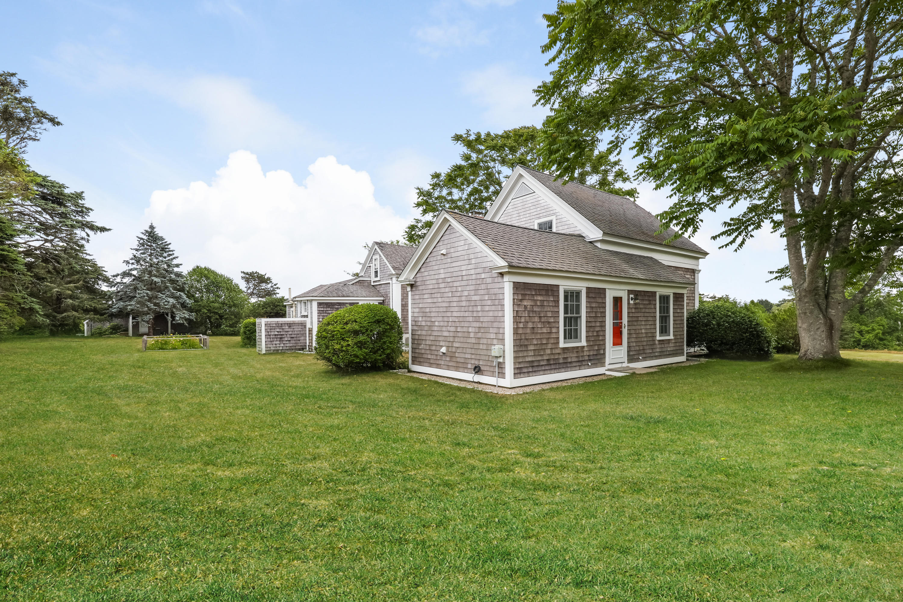 119 Scatteree Road North Chatham, MA 02650 - Photo 10 of 32 a view of a house with a big yard and large trees