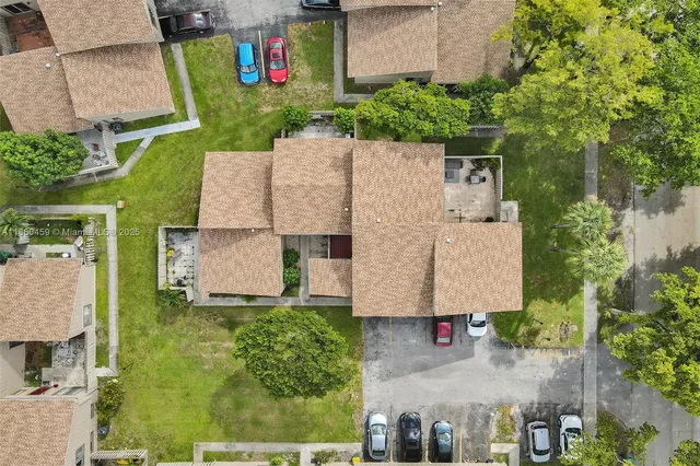 an aerial view of residential house with outdoor space and swimming pool