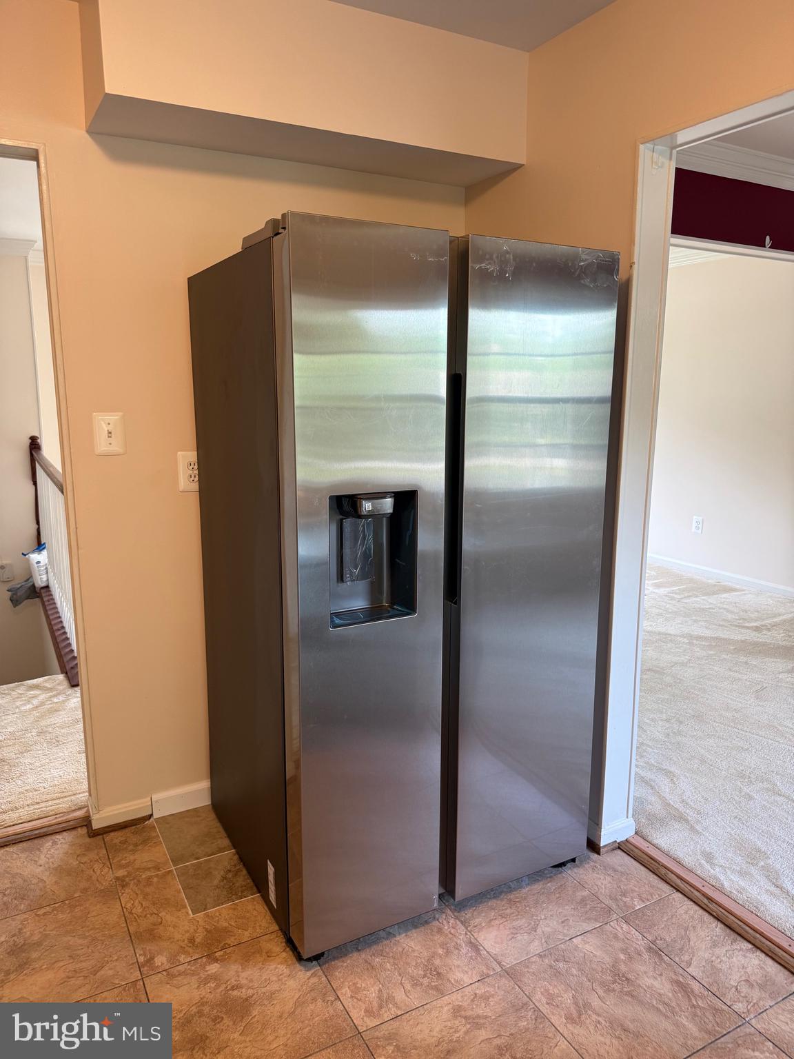 11724 Roosevelt Road Fredericksburg, VA 22407 - Photo 15 of 20 a view of a refrigerator in kitchen and a glass cabinet door