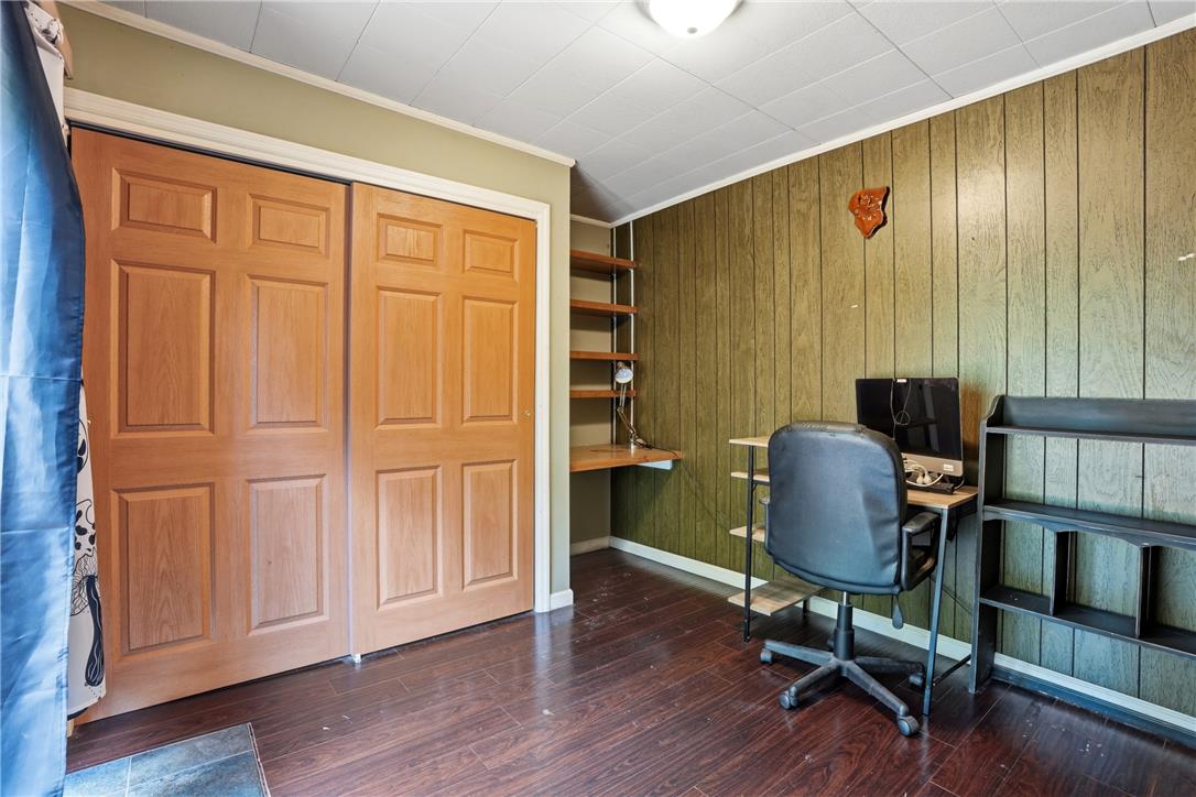3573 Lower Saucon Road Hellertown, PA 18055 - Photo 19 of 56 Rich wood-look flooring and classic paneling create a cozy atmosphere in this versatile home office.
