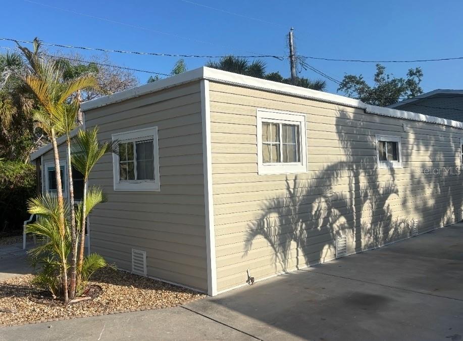 10315 Cortez Road West, Unit 1B Bradenton, FL 34210 - Photo 1 of 49 a front view of a house with a yard