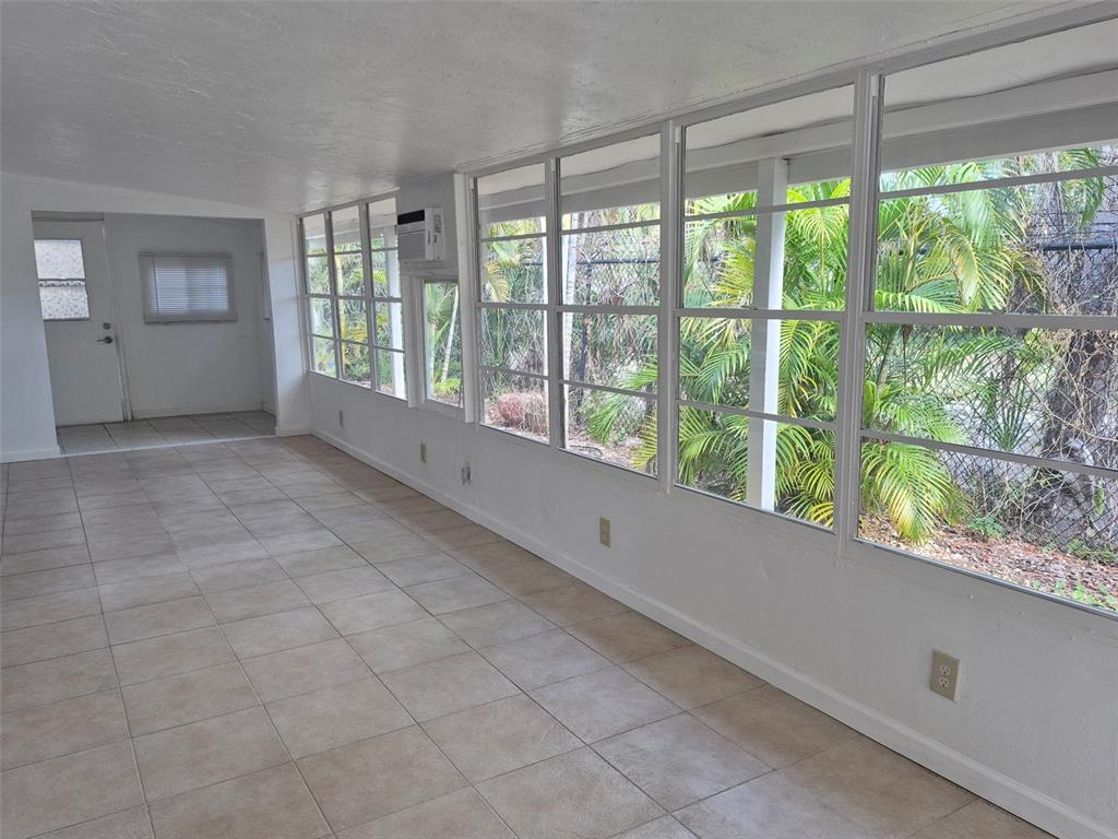10315 Cortez Road West, Unit 1B Bradenton, FL 34210 - Photo 12 of 49 a view of an empty room and window