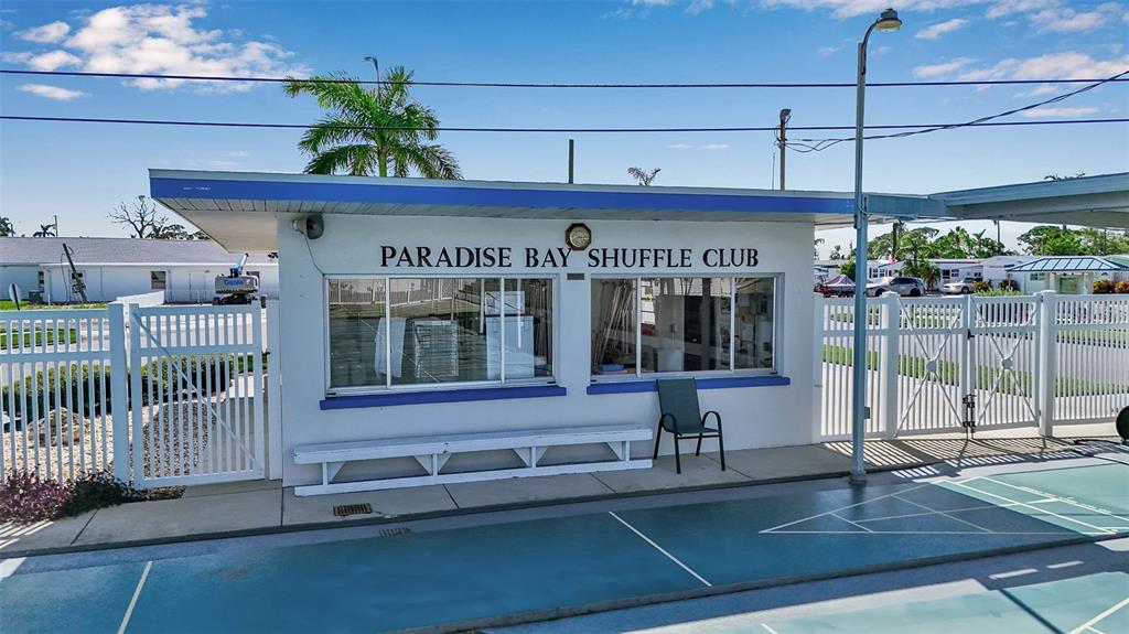 10315 Cortez Road West, Unit 1B Bradenton, FL 34210 - Photo 35 of 49 a view of a building with a porch