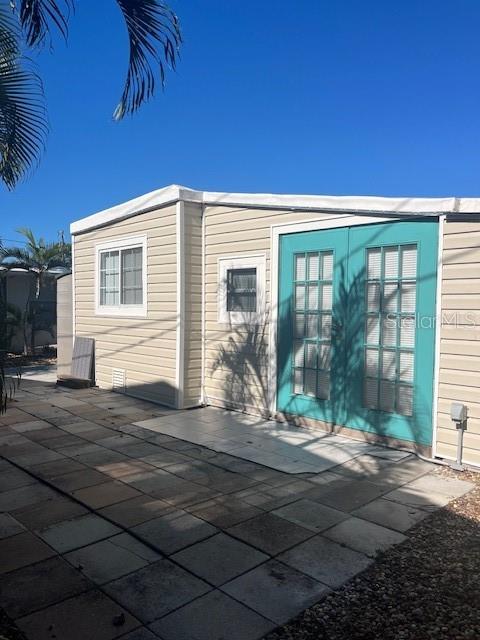 10315 Cortez Road West, Unit 1B Bradenton, FL 34210 - Photo 4 of 48 a front view of a house with a yard