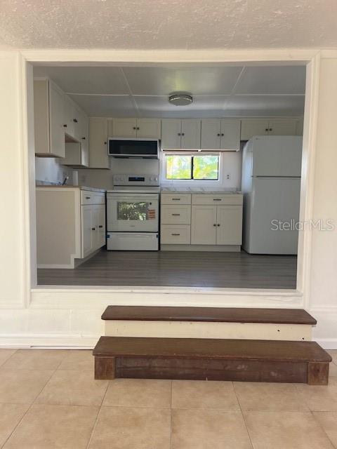 10315 Cortez Road West, Unit 1B Bradenton, FL 34210 - Photo 7 of 48 a view of kitchen with stainless steel appliances cabinets and a window