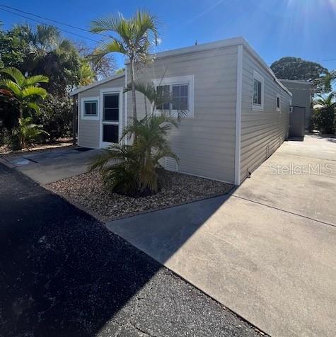 10315 Cortez Road West, Unit 1B Bradenton, FL 34210 - Photo 8 of 49 a front view of a house with garden