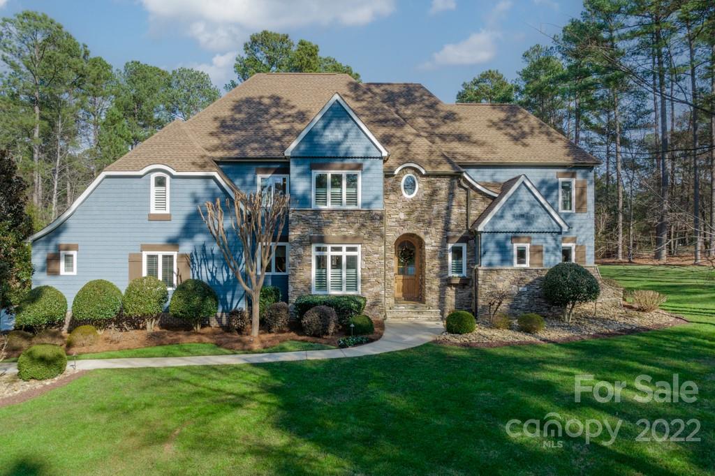 104 Maddaket Loop Mooresville, NC 28117 - Photo 1 of 45 a view of a house with a yard and plants
