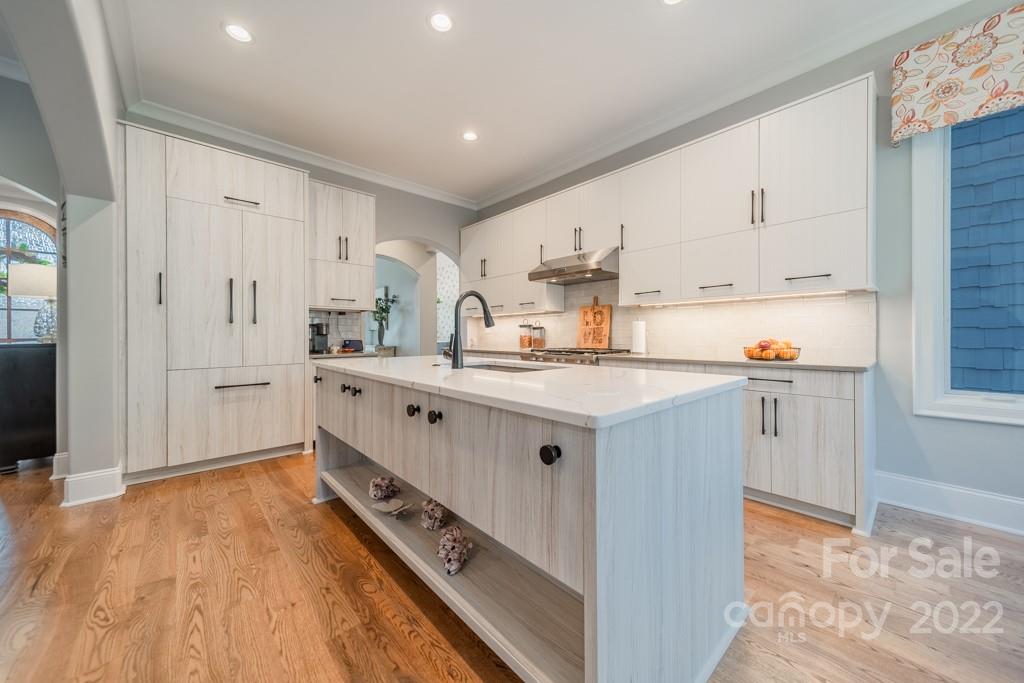 104 Maddaket Loop Mooresville, NC 28117 - Photo 12 of 45 a kitchen with white cabinets and appliances