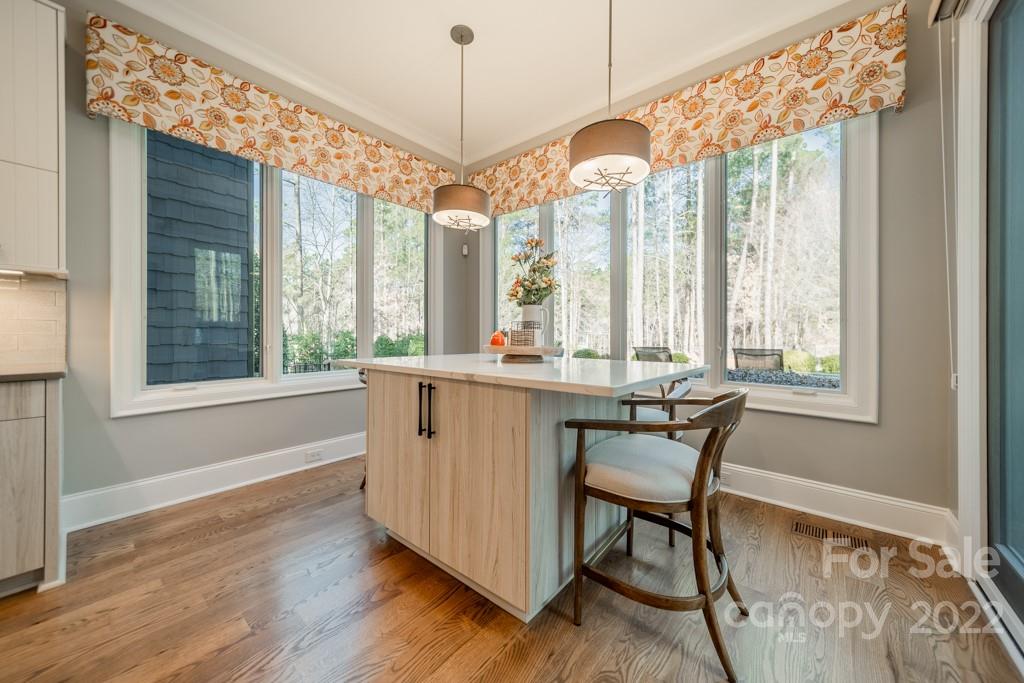 104 Maddaket Loop Mooresville, NC 28117 - Photo 14 of 45 a view of a dining room with furniture window and outside view