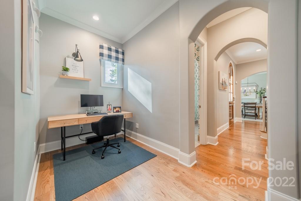 104 Maddaket Loop Mooresville, NC 28117 - Photo 17 of 45 a workspace with wooden floor and a rug
