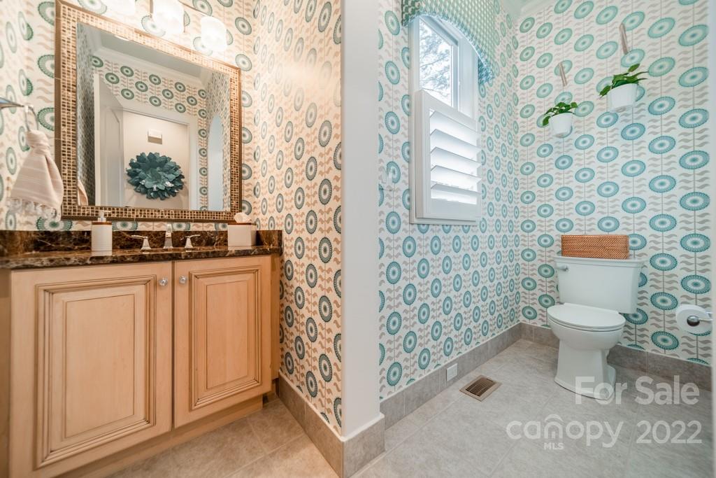 104 Maddaket Loop Mooresville, NC 28117 - Photo 18 of 45 a bathroom with a toilet and a shower curtain