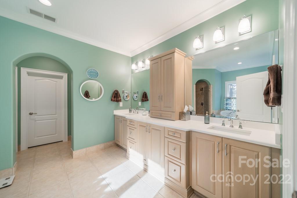 104 Maddaket Loop Mooresville, NC 28117 - Photo 26 of 45 a spacious bathroom with a double vanity sink and mirror