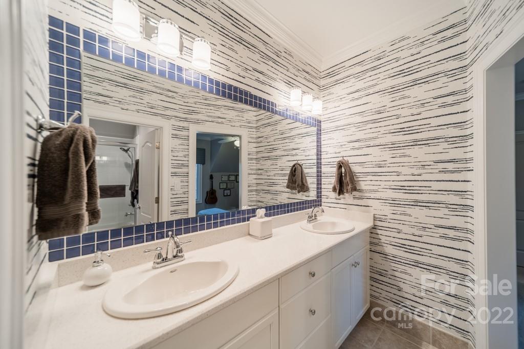 104 Maddaket Loop Mooresville, NC 28117 - Photo 29 of 45 a bathroom with a sink and a mirror