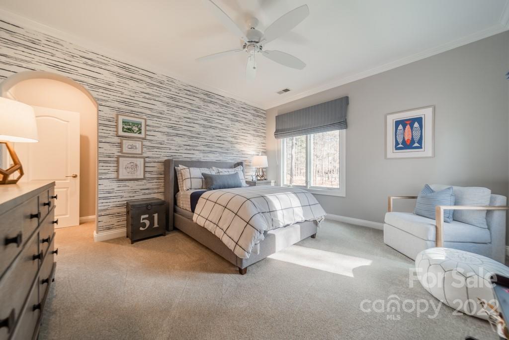 104 Maddaket Loop Mooresville, NC 28117 - Photo 32 of 45 a bedroom with a bed couch and window