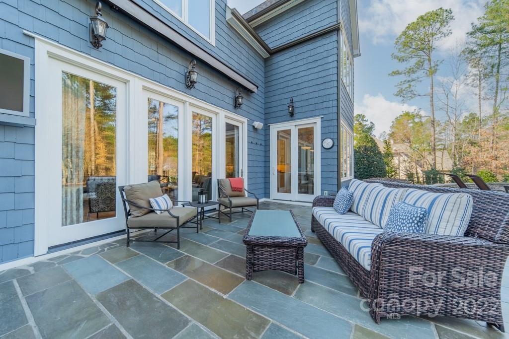 104 Maddaket Loop Mooresville, NC 28117 - Photo 37 of 45 a outdoor living space with furniture and a potted plant