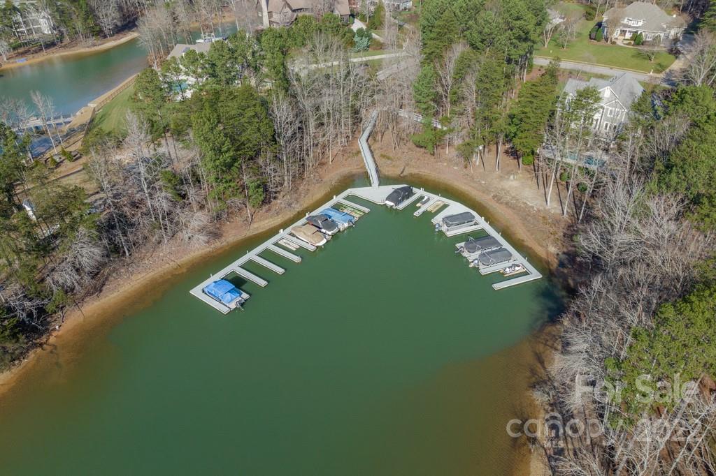 104 Maddaket Loop Mooresville, NC 28117 - Photo 40 of 45 a view of a lake with a yard