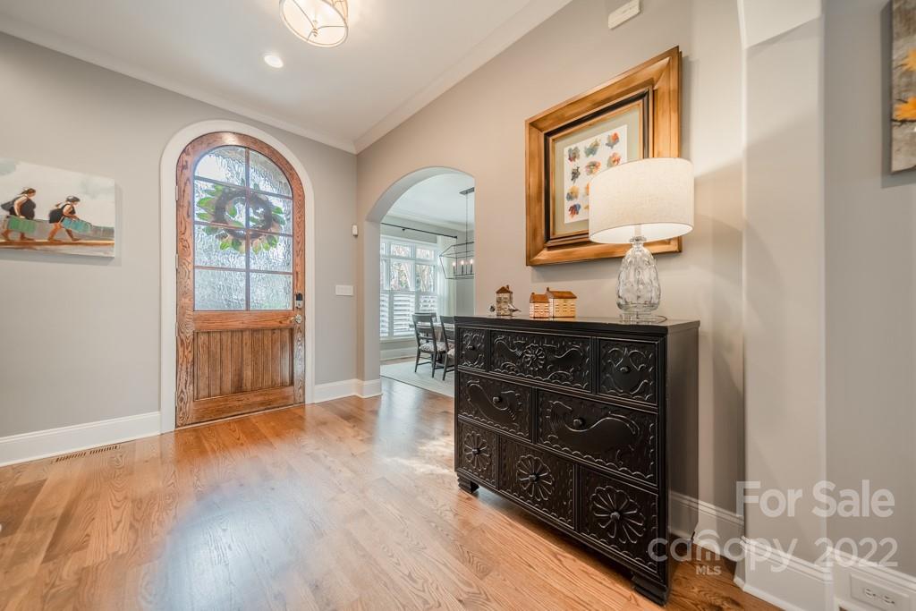 104 Maddaket Loop Mooresville, NC 28117 - Photo 5 of 45 workspace with wooden floor cabinet and mirror