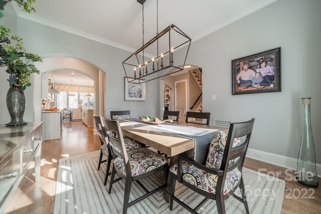 104 Maddaket Loop Mooresville, NC 28117 - Photo 9 of 45 a view of a dining room with furniture wooden floor and a chandelier