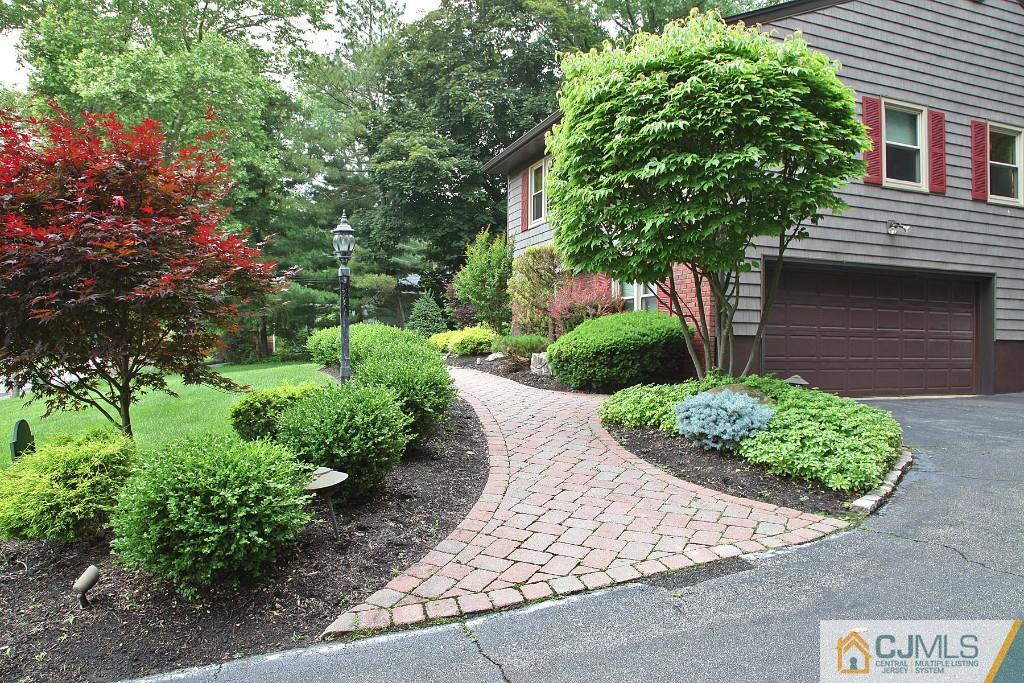25 Clive Hills Road Edison, NJ 08820 - Photo 2 of 25 a front view of a house with garden