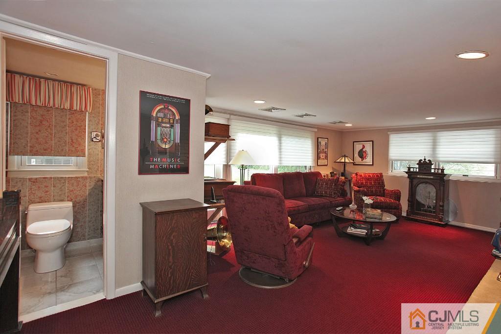25 Clive Hills Road Edison, NJ 08820 - Photo 12 of 25 a living room with furniture and a table