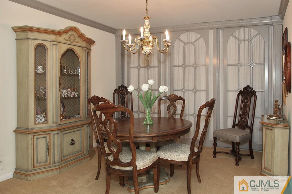 25 Clive Hills Road Edison, NJ 08820 - Photo 15 of 25 a view of a dining room with furniture and chandelier