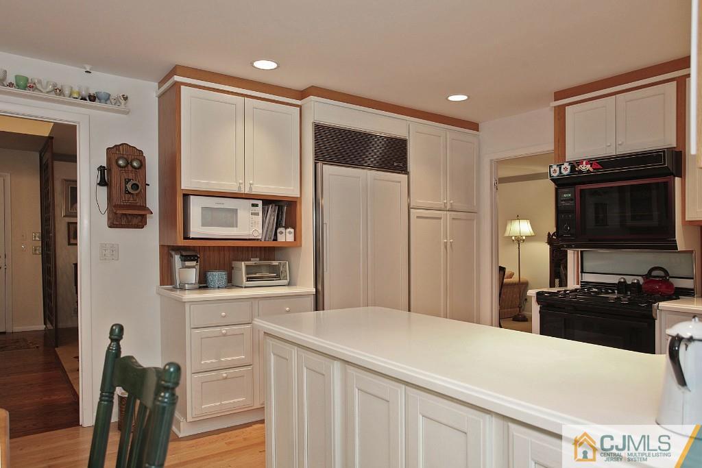 25 Clive Hills Road Edison, NJ 08820 - Photo 18 of 25 a kitchen with stainless steel appliances a refrigerator stove and microwave