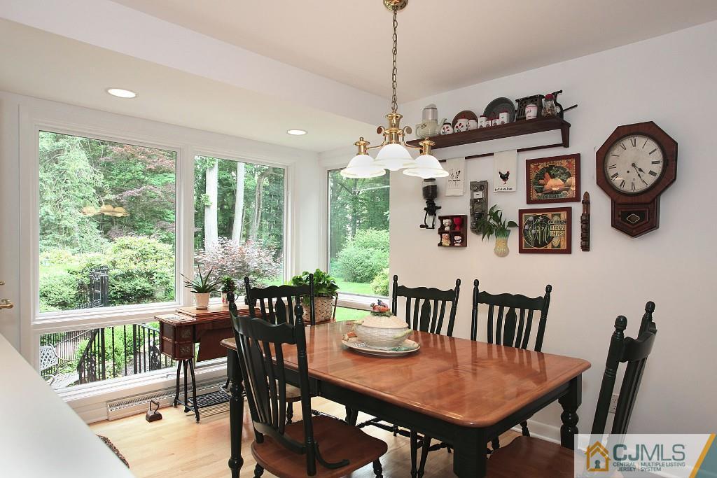 25 Clive Hills Road Edison, NJ 08820 - Photo 19 of 25 a view of a dining room with furniture window and wooden floor