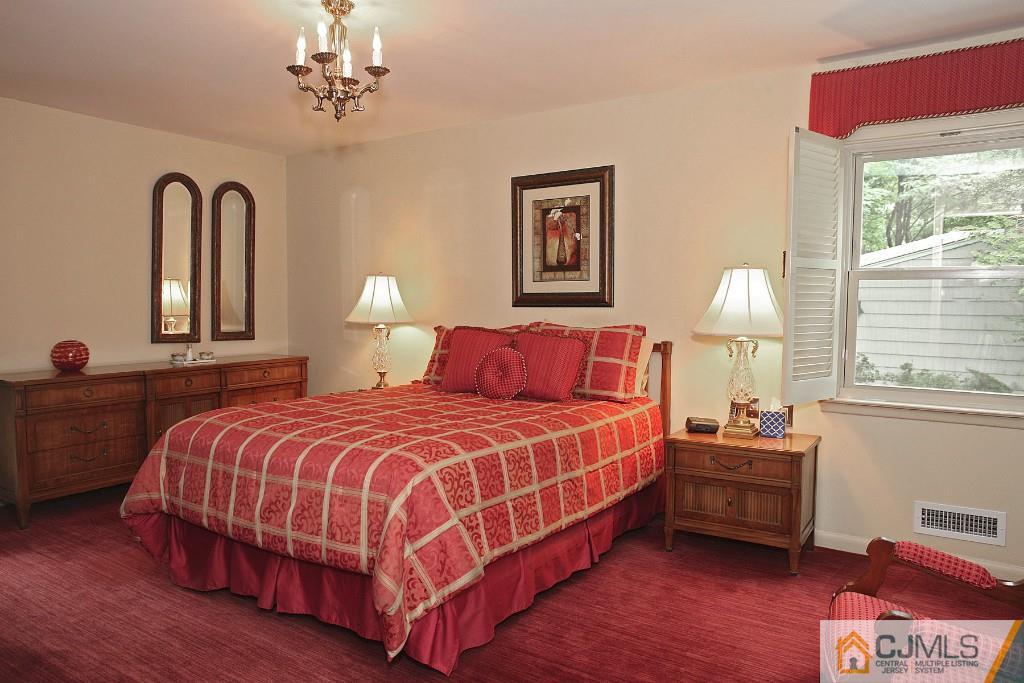 25 Clive Hills Road Edison, NJ 08820 - Photo 20 of 25 a bedroom with bed and a window