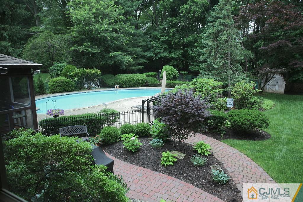 25 Clive Hills Road Edison, NJ 08820 - Photo 3 of 25 a view of a garden with large trees