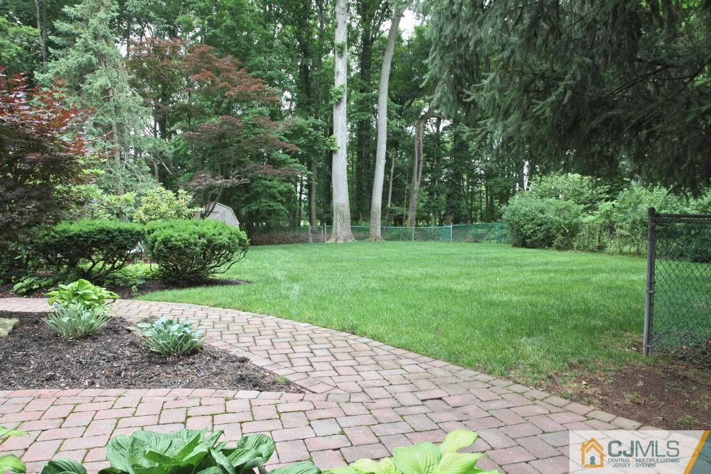 25 Clive Hills Road Edison, NJ 08820 - Photo 7 of 25 a backyard of a house with lots of green space