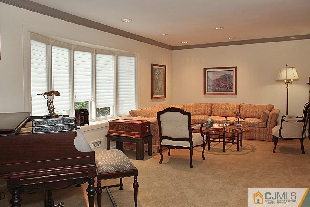 25 Clive Hills Road Edison, NJ 08820 - Photo 10 of 25 a living room with furniture and a window