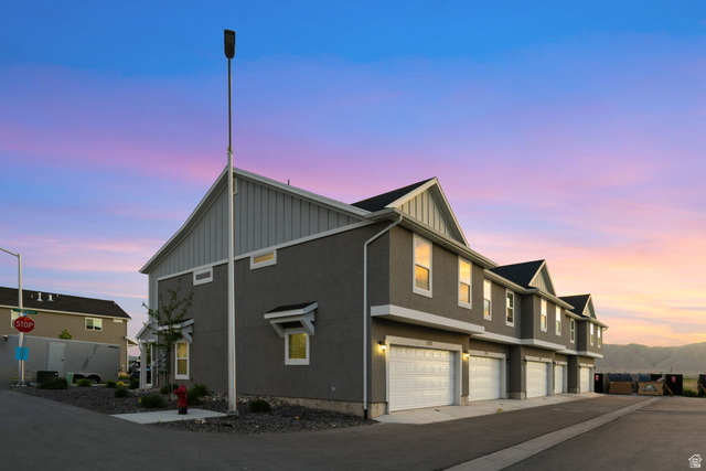 1223 East 1775 North Payson, UT 84651 - Photo 5 of 45 Contemporary multi-story townhome residences featuring a stucco and siding exterior, individual garages, and a paved driveway