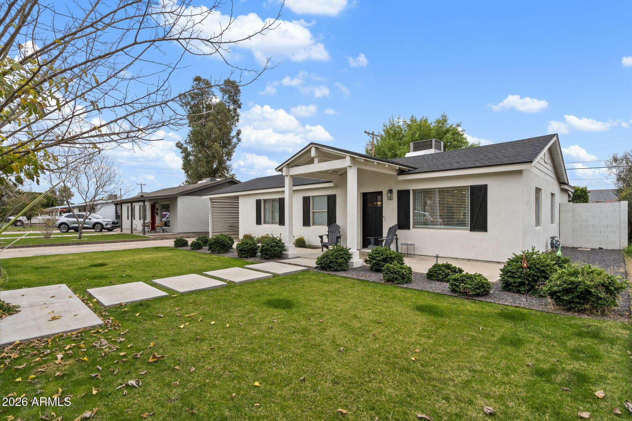 a front view of a house with a yard