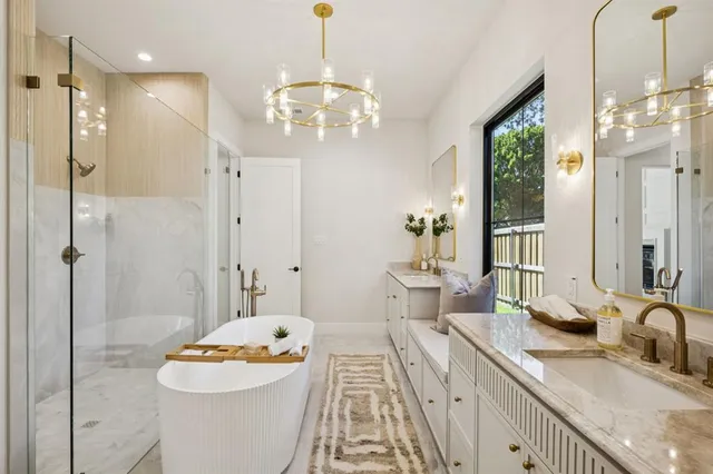 a spacious bathroom with a granite countertop sink a toilet and shower