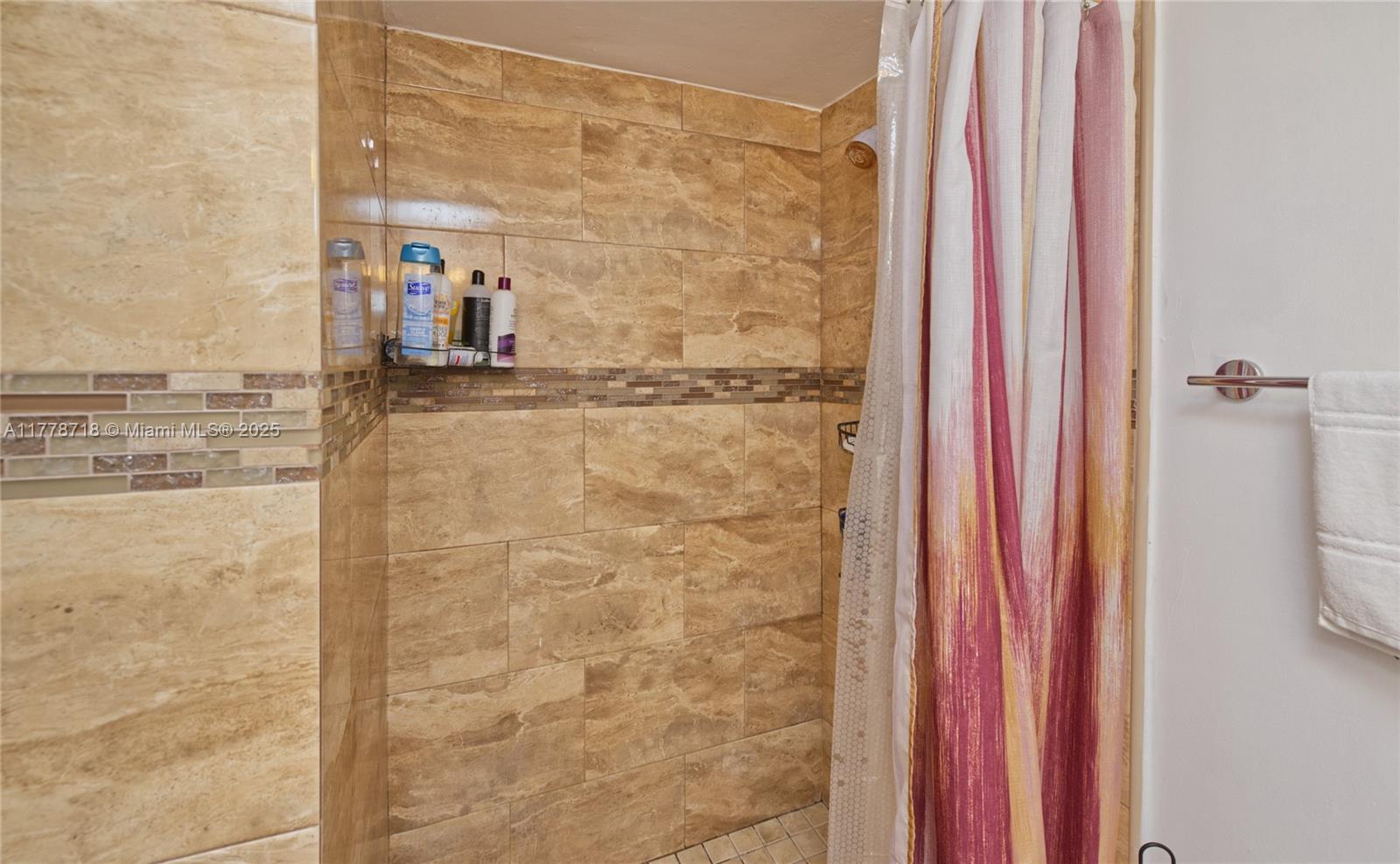 3195 Foxcroft Road, Unit F302 Miramar, FL 33025 - Photo 14 of 28 a bathroom with a shower
