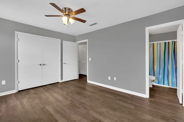 a view of room with window and ceiling fan