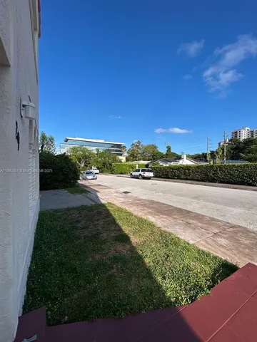 a view of a yard with an ocean