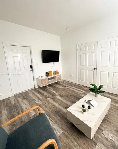 a living room with a couch and a flat screen tv